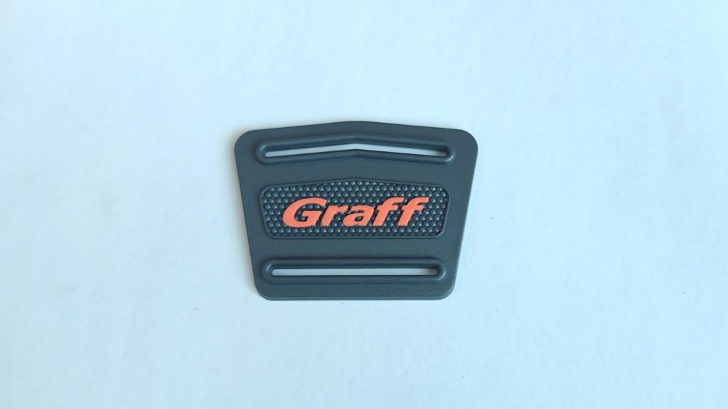 Apparel labels — textured marker with two elongated holes — actual product photo 1