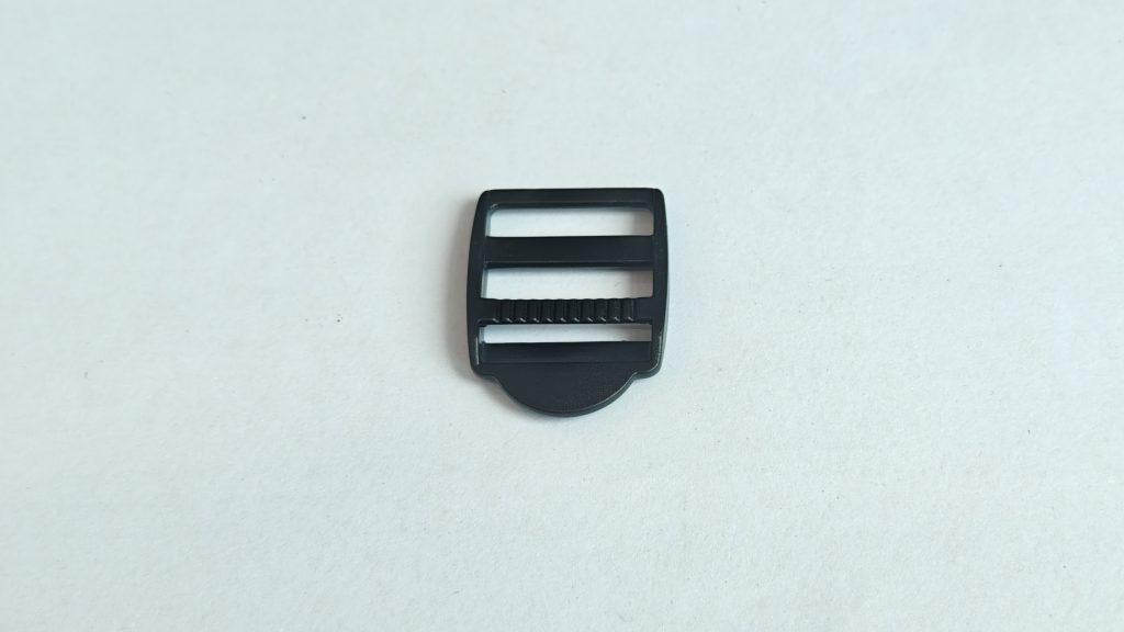 Tri-glide buckle with straight frame, crossbar, and semicircular pull tab, product photo 1