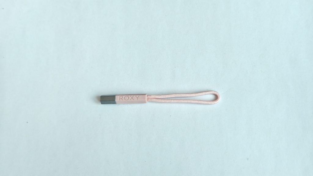 Zipper pull cord with metal end cap and logo grip, product photo 1