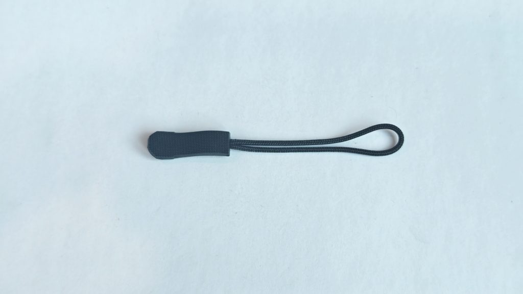 Zipper pull cord, elongated waisted fine-textured grip, actual product photo 1